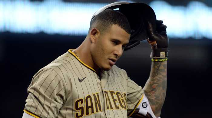 Aug 14, 2021; Phoenix, Arizona, USA; San Diego Padres third baseman Manny Machado (13) sheds his helmet after striking out against the Arizona Diamondbacks during the first inning at Chase Field. Mandatory Credit: